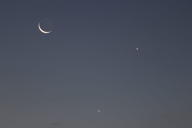 A close-up with the Moon, Venus and an airplane