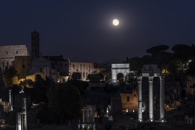 The beautiful Full Moon is shining above the Roman Forum