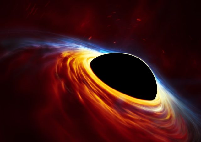 Questa rappresentazione artistica mostra un buco nero supermassiccio in rapida rotazione, circondato da un disco d'accrescimento. Questo disco sottile di materia in rotazione intorno al buco nero rappresenta ciò che rimane di una stella simile al Sole ridotta in brandelli dalle forze mareali del buco nero. Le onde d'urto nei detriti prodotti dalla collisione e il calore generato dall'accrescimento producono un lampo di luce che ricorda l'esplosione di una supernova. Crediti: ESO, ESA/Hubble, M. Kornmesser
