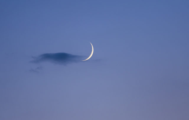 A very sharp Moon crescent was caressed by a very delicate cloud