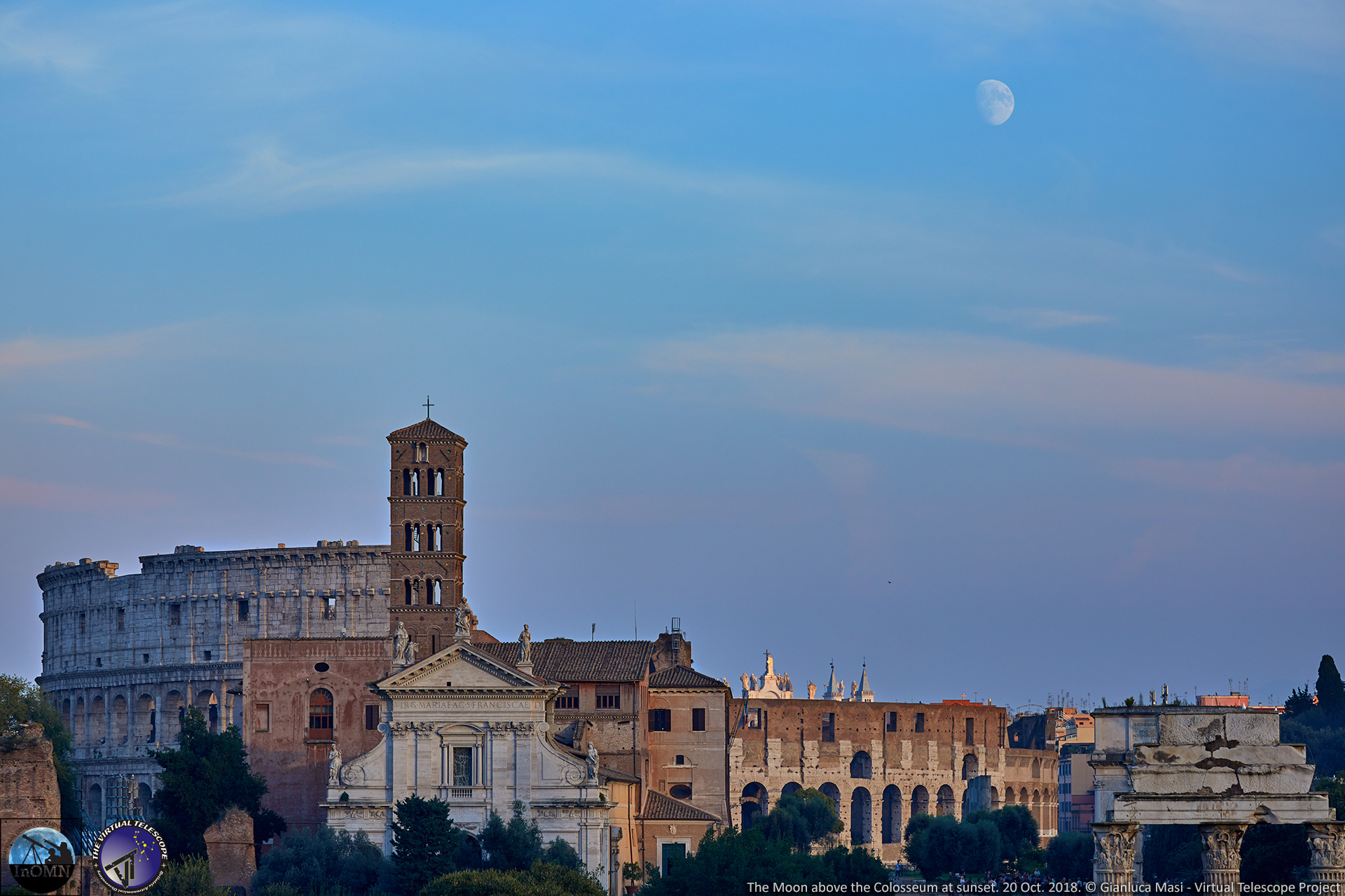 A pale Moon hangs above the Colosseum at sunset - 20 Oct. 2018