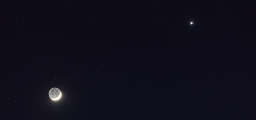 The Moon and planet Venus, against a darker, starry sky. 26 Apr. 2020