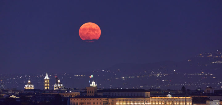The Full Moon rises above “Palazzo del Quirinale”, in Rome.