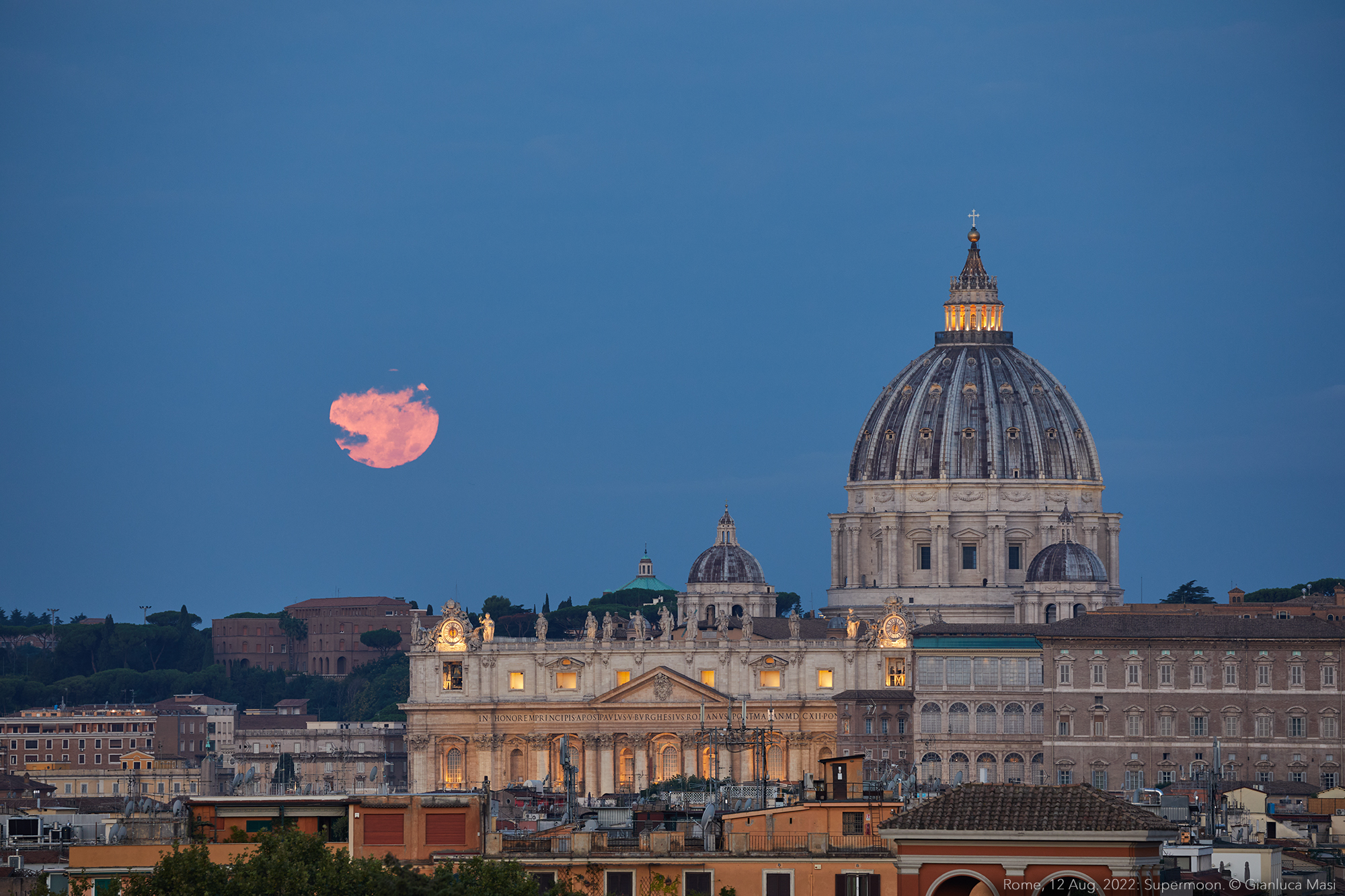 The "Sturgeon" Supermoon 2022 sets hangs above the St. Peter's Basilica - 12 Aug. 2022.