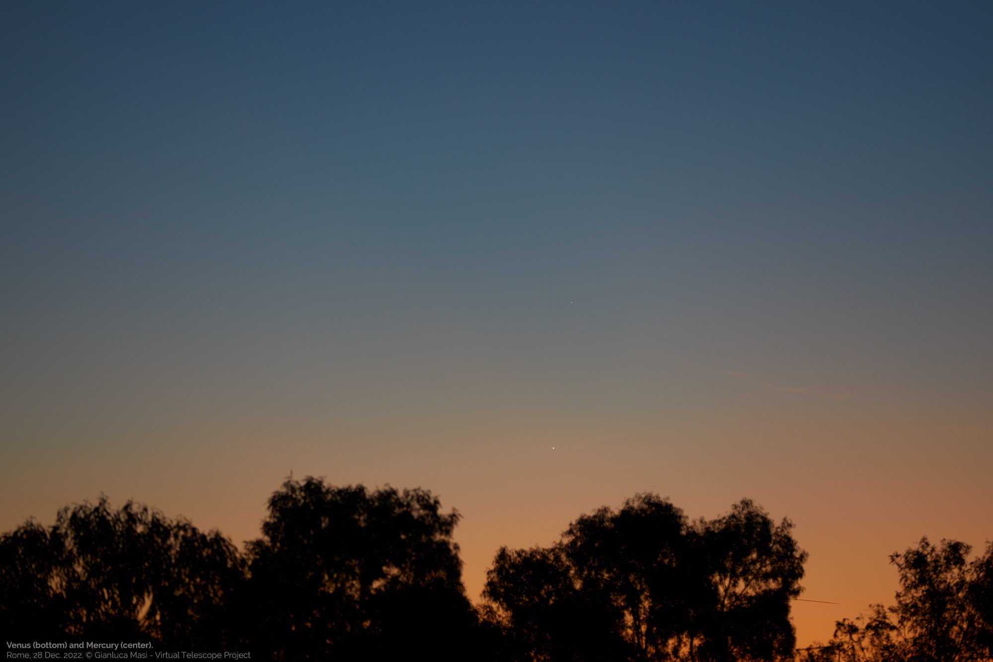 Venus and Mercury shine in a very colorful sky. 