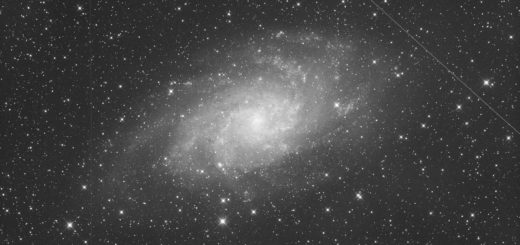 Messier 33, with a couple of satellite trails.