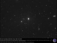 NGC 6543, the "Cat's Eye" planetary nebula, and galaxy NGC 6552.