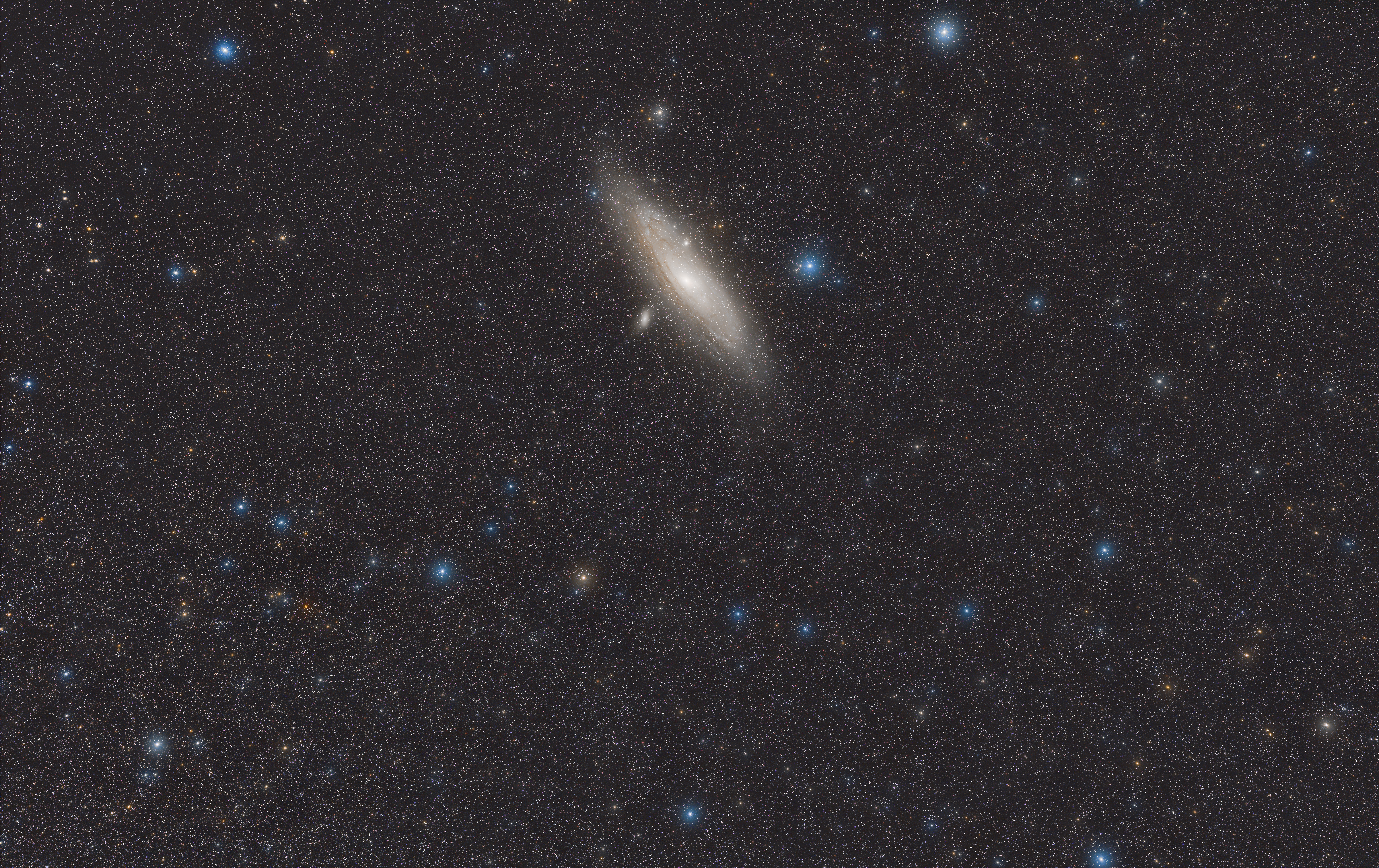 The Andromeda Galaxy (M 31, NGC 224), its M 32 and M 110 satellites and the stars around it.